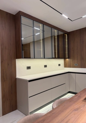 White and walnut kitchen cabinetry with mirrored glass upper units by Mr. Home